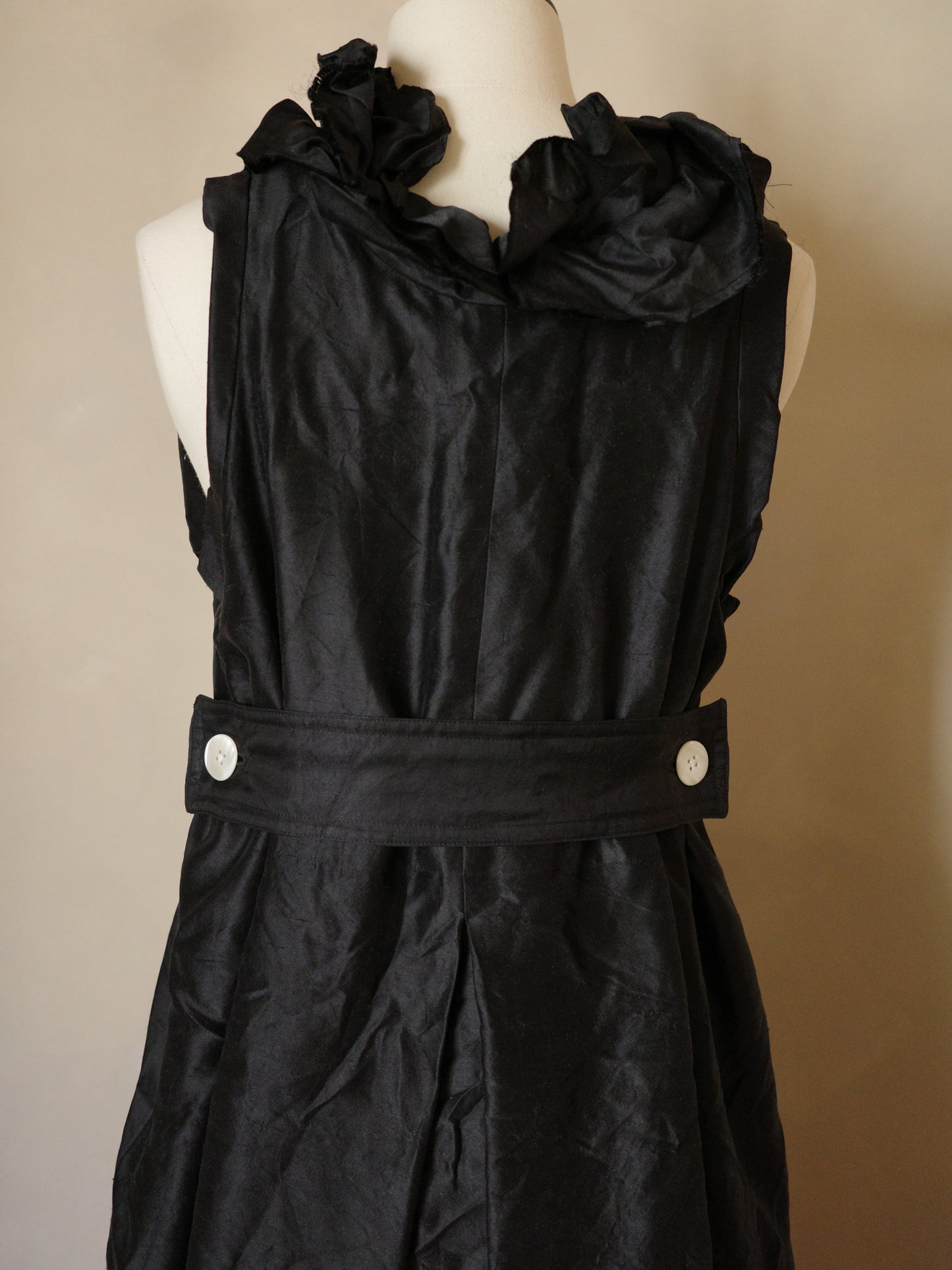 Sleeveless black silk dress